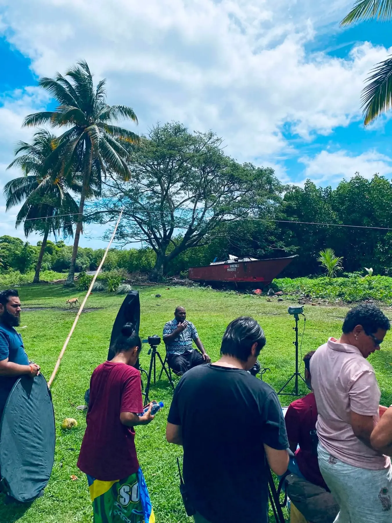 Production crew filming in the field
